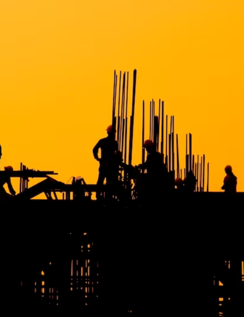 Image of a JMT Manufacture worker at a construction site, showcasing professionalism and hands-on expertise in fabrication and building projects.